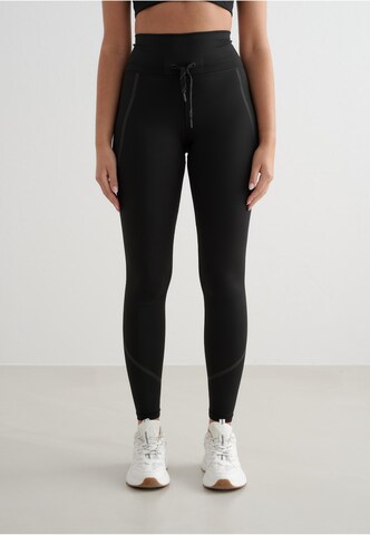 Aim'n Skinny Sports trousers in Black: front