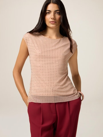 Top di oltre in rosa