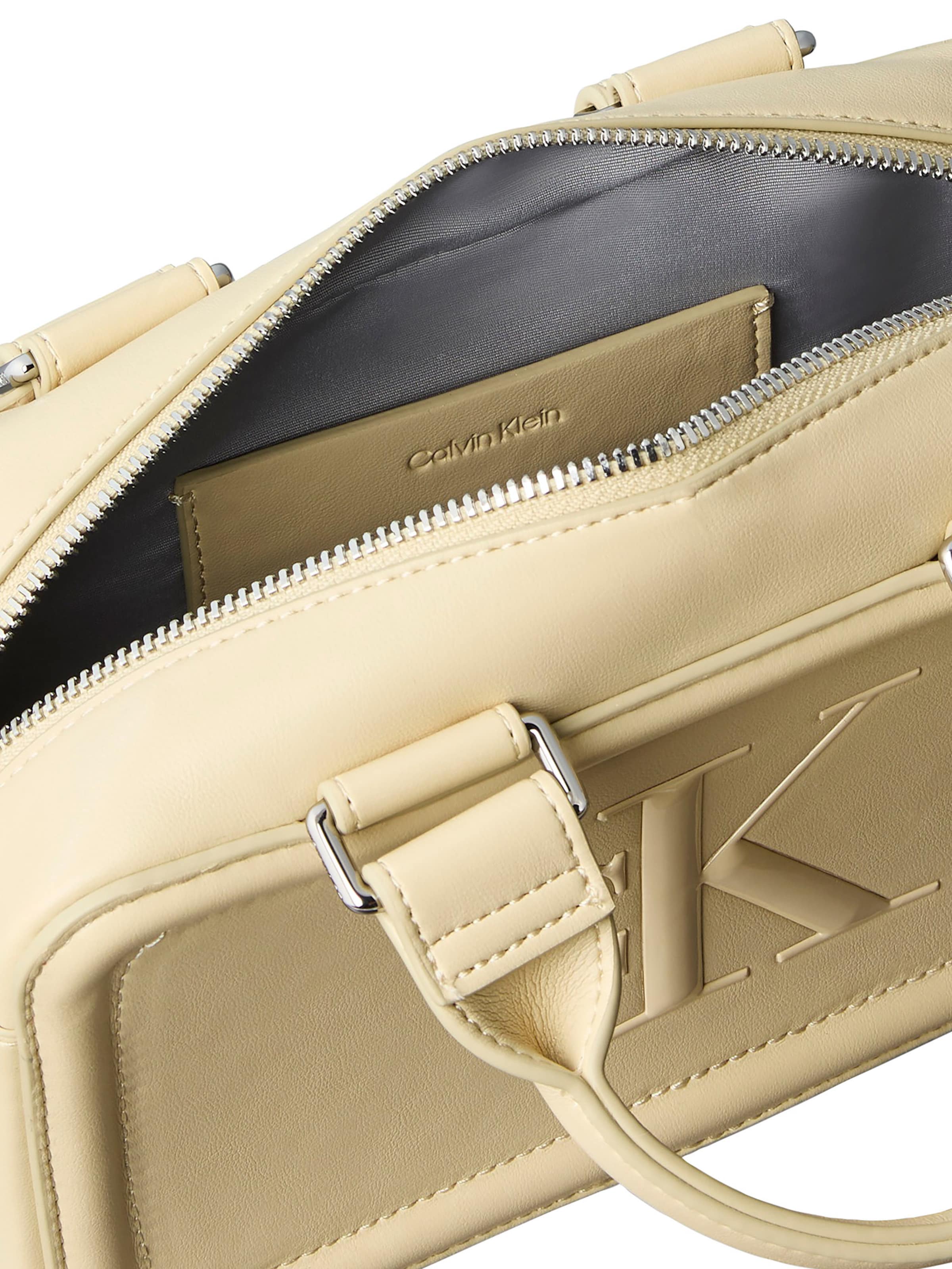 Calvin Klein Kézitáska 'BOLD ELONGATED MINI' - bézs