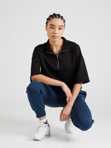 Effilé Pantalon de sport 'Phoenix Fleece' Nike Sportswear en bleu