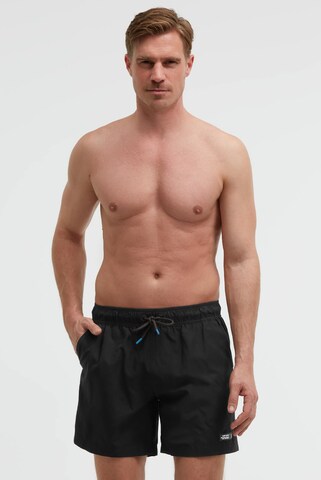 CAMP DAVID Board Shorts in Black: front