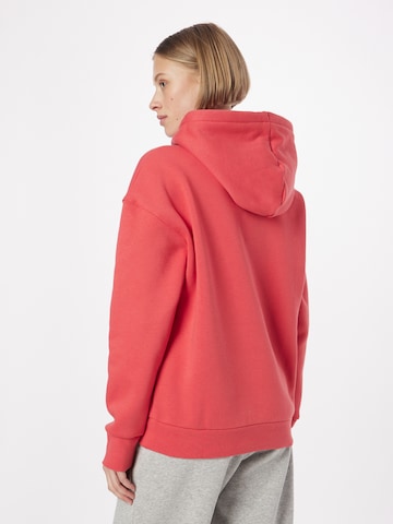 Sweat de sport UNDER ARMOUR en rouge