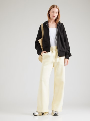 Wide Leg Pantalon de sport 'Phoenix' NIKE en jaune