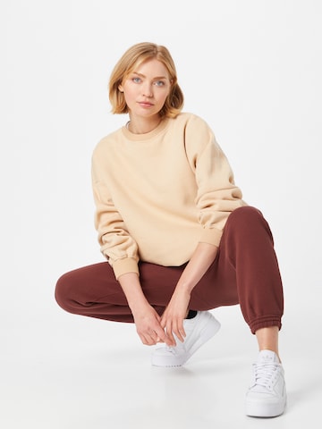 ABOUT YOU Tapered Broek 'Cara' in Bruin