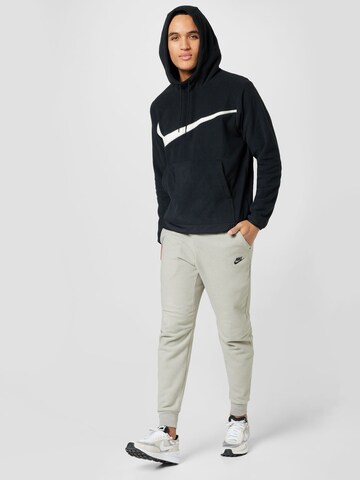 Nike Sportswear Tapered Trousers in Beige