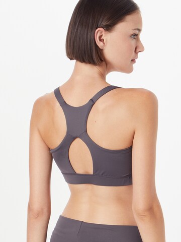 Bustino Reggiseno sportivo di CURARE Yogawear in grigio