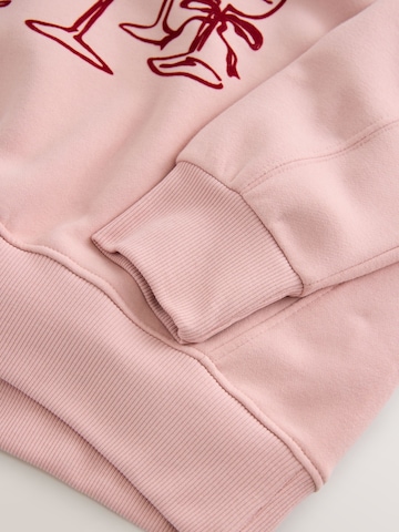 Next Collegepaita 'Christmas Champagne Tree' värissä vaaleanpunainen