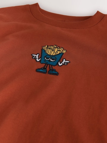 Next - Camiseta en naranja