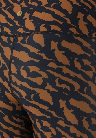 Athlecia Skinny Sports trousers 'Windia' in Brown