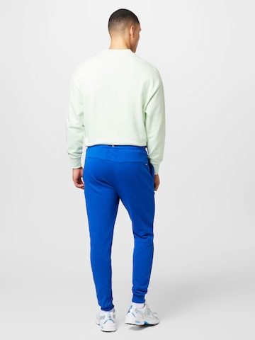 TOMMY HILFIGER Tapered Trousers in Blue