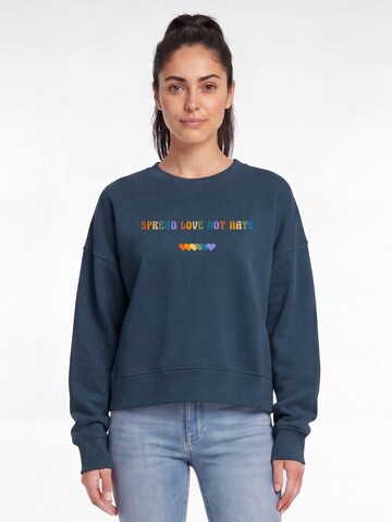 Watapparel Sweatshirt 'Spread Love Not Hate' in Green: front