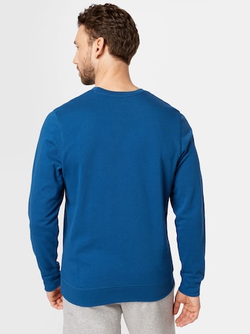 UNDER ARMOUR - Sweatshirt de desporto em azul