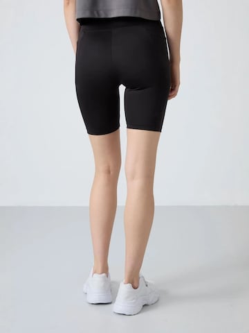 Tommy Life - Tapered Leggings 'Gamaschen' em preto