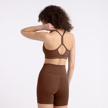 new balance Bralette Sports bra 'Essential' in Brown
