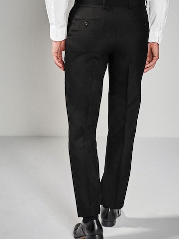 Coupe slim Pantalon à plis Next en noir