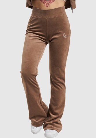 Karl Kani Flared Pants in Brown: front
