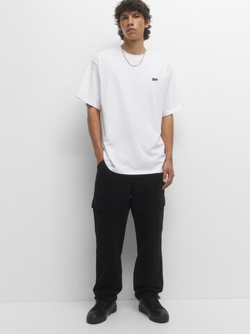 Pull&Bear Loosefit Gargohousut värissä musta