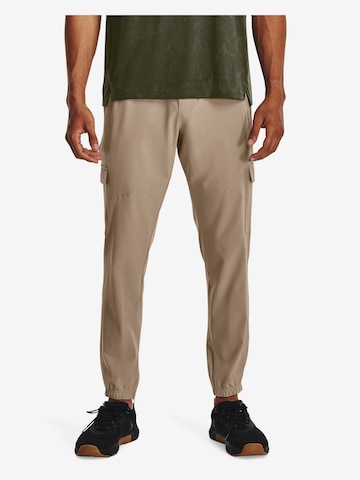 UNDER ARMOUR Tapered Workout Pants in Beige: front