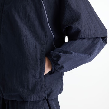 Giacca sportiva 'Sport Legacy Jacket' di new balance in blu