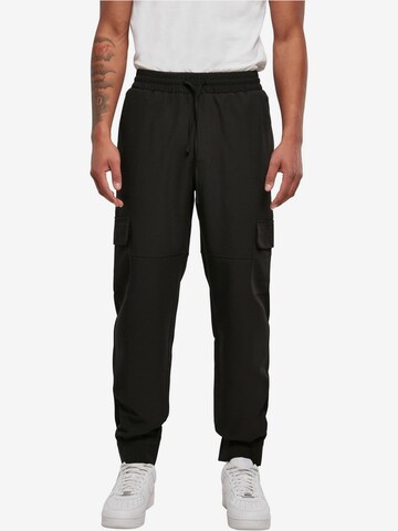 Tapered Pantaloni cargo di Urban Classics in nero: frontale