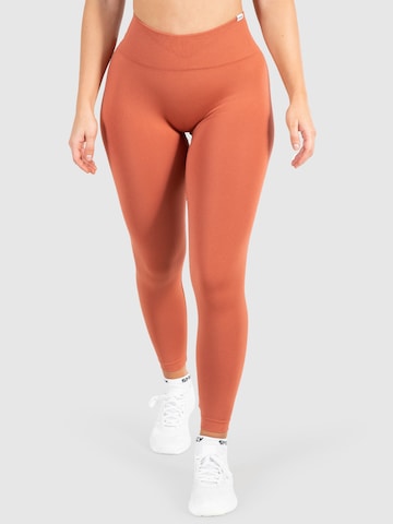 Smilodox Skinny Workout Pants 'Amaze Pro' in Orange: front