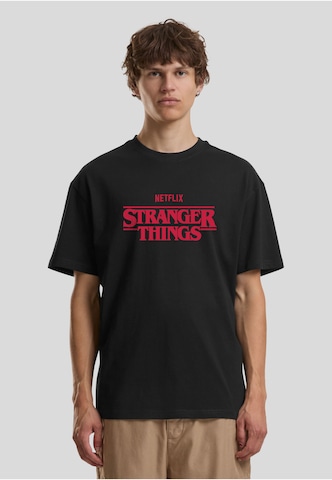 Merchcode Tričko 'Stranger Things Rewatch' – černá