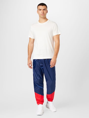 Nike Sportswear Дънки Tapered Leg Панталон в синьо