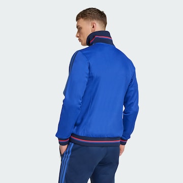 Veste de survêtement 'Olympique Lyon Anniversary' ADIDAS ORIGINALS en bleu