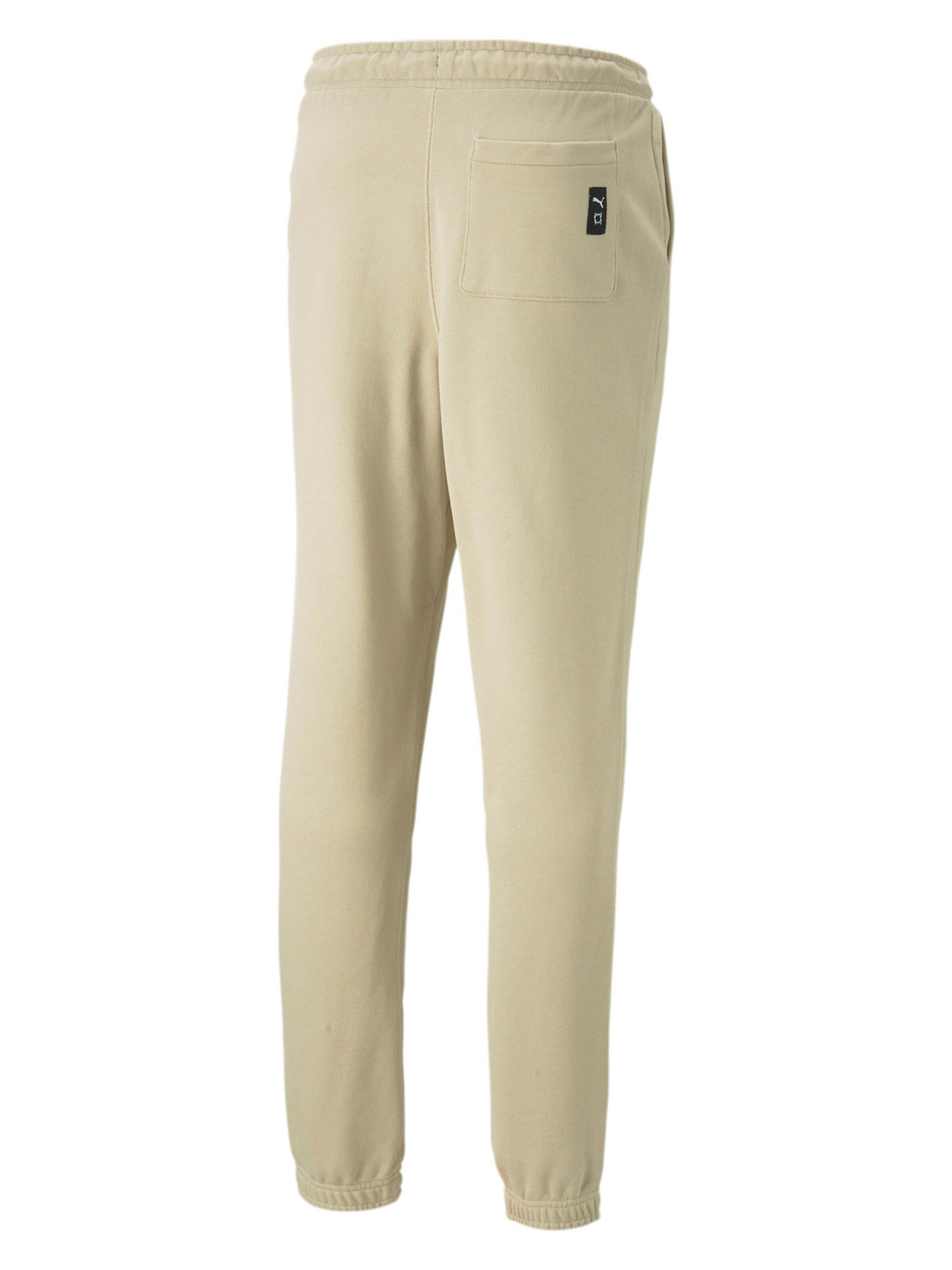PUMA Regular Sports trousers 'Pivot' in Beige