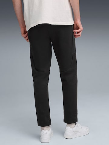 regular Pantaloni sportivi 'Puma Evostripe Pants Dk' di PUMA in nero