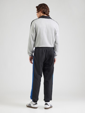 Tapered Pantaloni 'BRUSHED' di ADIDAS ORIGINALS in nero