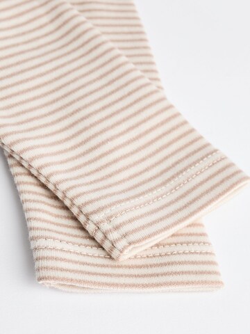 Next Sparkdräkt/body i beige
