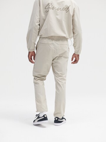 Sinned x ABOUT YOU Regular Trousers 'Hannes' in Beige