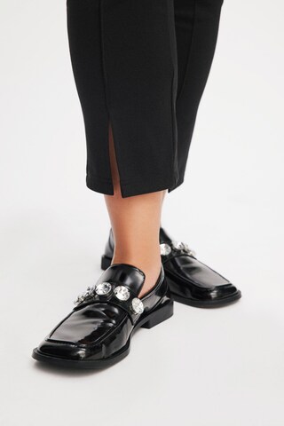 EVOKED Skinny Leggingsit 'Viloggi' värissä musta