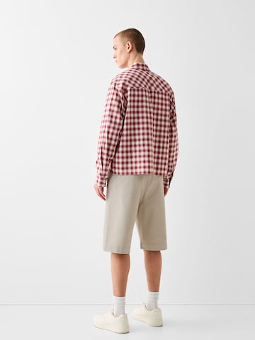 Bershka Loosefit Chino kalhoty – béžová