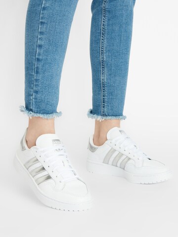 ADIDAS ORIGINALS Platform trainers in White: front