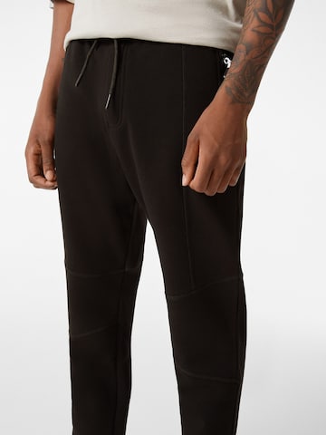 Bershka Дънки Tapered Leg Панталон в черно