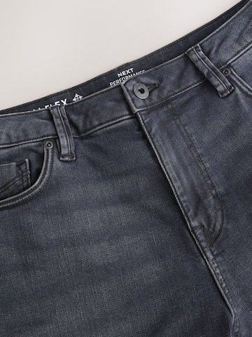 Coupe slim Jean 'Motionflex' Next en mélange de couleurs