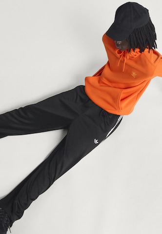 ADIDAS ORIGINALS Loosefit Hose 'Adicolor' in Schwarz