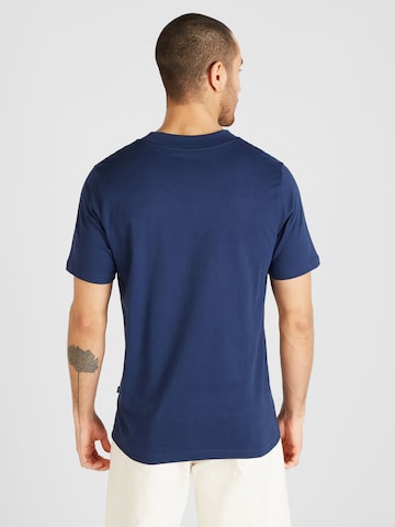 new balance Koszulka w kolorze niebieski
