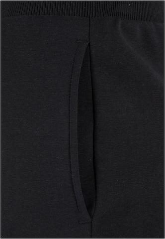 Tapered Pantaloni di Urban Classics in nero