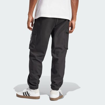 Tapered Pantaloni funzionali 'City Escape Premium' di ADIDAS SPORTSWEAR in nero