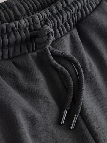 Next - Tapered Pantalón en gris