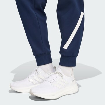ADIDAS PERFORMANCE Tapered Sportbroek 'France Travel' in Blauw