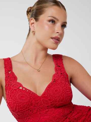 GUESS Earrings in Gold: front