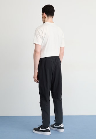 Nike Sportswear Дънки Tapered Leg Панталон в черно