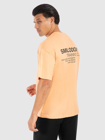 T-Shirt ' Cyris ' Smilodox en orange