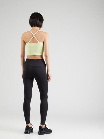 TRIUMPH Skinny Športne hlače 'Cardio' | črna barva