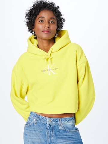 Calvin Klein JeansSweater majica - žuta boja: prednji dio