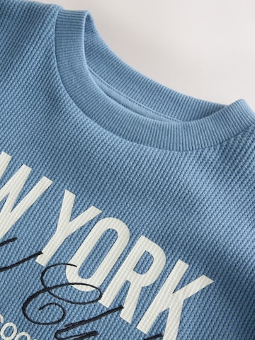 Next - Camiseta en azul